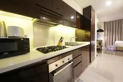a kitchen with a stove and a microwave at Silk Valley - Luxury DAMAC Studio near Dubai Mall & Burj Khalifa in Dubai