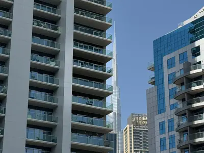 a tall building with balconies in a city at Werova - Spacious 3-Bedroom Near Dubai Mall in Dubai