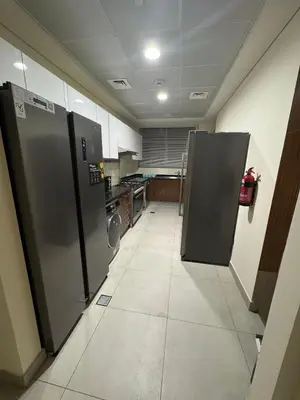 a kitchen with two refrigerators in a room at Joyful Journeys Marina Arcade Private Room for 2 - Shared Kitchen in Dubai