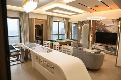 a living room with a pool table at The Royale Vista Burj Khalifa View Residence in Dubai