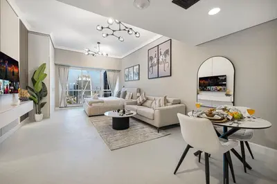 a living room with a couch and a table at Luxury JLT Studio Lakeview Near Metro & Marina in Dubai