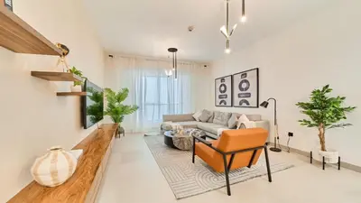 a living room with a couch and a chair at fam Living High Floor Stay in Sulafa Tower in Dubai