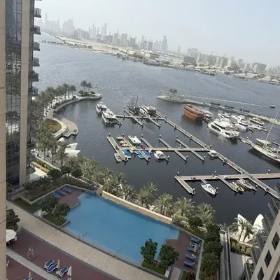 a view of a marina with boats in the water at Spacious Luxury Apartment Stunning Creek Views Family Friendly in Dubai
