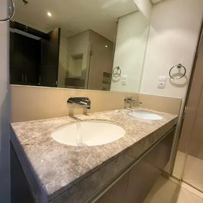 a bathroom with two sinks and a large mirror at Spacious Luxury Apartment Stunning Creek Views Family Friendly in Dubai