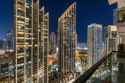 a city skyline at night with tall buildings at Modern stylish 2BR Apartment walk to Dubai Mall near Burj Khalifa in Dubai
