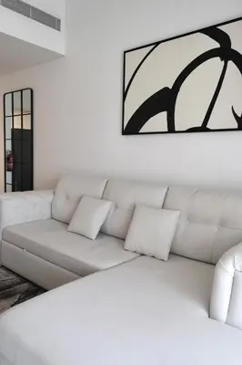 a white living room with a white couch at 1BR Madinat Jumeirah Living in Dubai