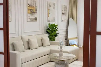 a living room with a white couch and a table at Luxury Condo 3 BR in Dubai Marina Sulafa 4004 in Dubai