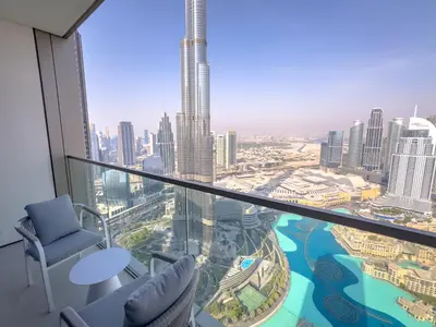 a room with a view of the dubai city at GRANDE SIGNATURE with a direct Burj Khalifa view and Private Fountain Show at 62nd floor with DXB AIRPORT VIP Shuttle option for 6 guests in Dubai
