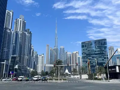 a city with a street with cars and tall buildings at Zada 1BR High Floor - Stunning View 1min Downtown and 2min to Metro in Dubai
