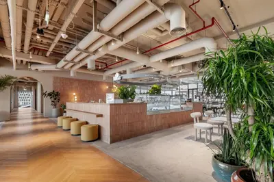a view of the lobby of a restaurant with plants at Executive Studio in Business Bay with Working Area, Pool, Gym in Dubai