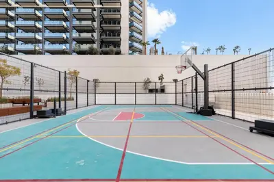 a basketball court in a building with a basketball hoop at Executive Studio in Business Bay with Working Area, Pool, Gym in Dubai