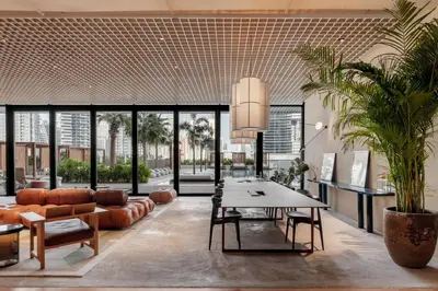a living room with a table and a couch at Executive Studio in Business Bay with Working Area, Pool, Gym in Dubai
