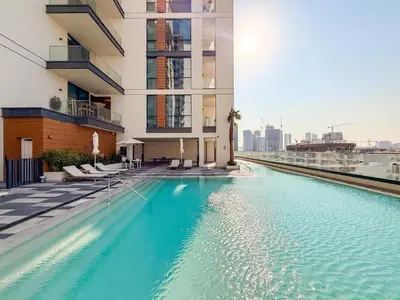 a swimming pool on the side of a building at GuestReady - 1BR l Stylish 10th-Floor Retreat in Dubai