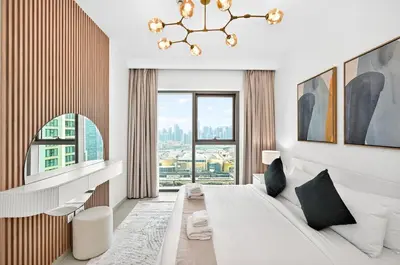 a bedroom with a large bed and a large window at Golden Stays - Stunning Downtown 2Br with Full Burj Views & Free Parking in Dubai