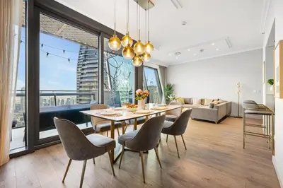 a dining room with a table and chairs at 3BR Direct Access to Dubai Mall and Burj Khalifa in Dubai