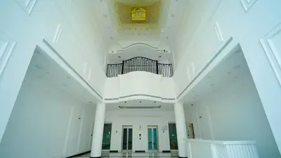 a large white building with a ceiling and a organ at Vincitore Benessere - Arjan by Golden Casa in Dubai