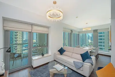 a living room with a couch and a table at 2BR 29Blvd Balcony Fountain View in Dubai