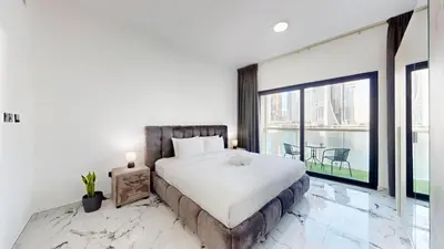 a bedroom with a large bed and a large window at Vacationer l Lux 2 Bedroom Apartment with Marina & Skyline View Prime Location in Dubai