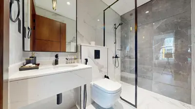 a bathroom with a toilet and a shower at Vacationer I Premium 2 Bedroom Apartment I Close to DIFC & WTC I Central Location in Dubai