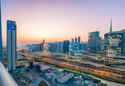 a view of a city at night with traffic at Venetian - High Floor 2BR Residence with Incredible Burj View in Dubai