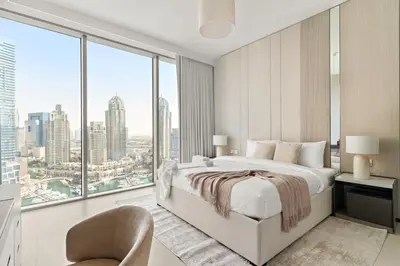 a bedroom with a bed and a large window at Luxury 1BR in LIV Marina with Canal Views in Dubai