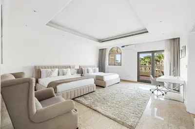a white living room with a couch and a bed at Luxury 5BR plus Maid Private Villa with Direct Beach Access in Dubai
