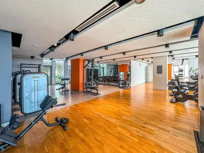 an empty gym with exercise bikes and exercise equipment at Mira Holiday Homes - Sky High Bliss at Bluewaters Residence 3 Ain View in Dubai