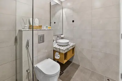 a bathroom with a toilet and a sink at Dubai Business Bay Luxurious Studio with Canal View and access to Lagoon Pool in Dubai