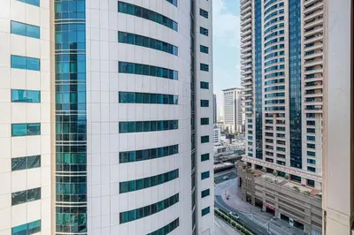 an aerial view of two tall buildings in a city at StayMada - Ocean Heights Panoramic Beach Views in Dubai