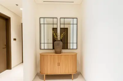 a vase sitting on top of a table in a room at CitiHome - Elie Saab Luxury 2BR - Sea View in Dubai