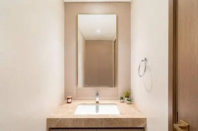 a bathroom with a sink and a mirror at CitiHome Luxury Stay Panoramic Sea Views 2BR in Dubai
