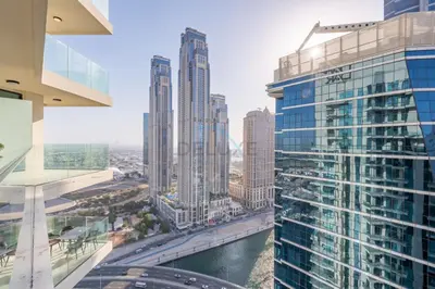 an aerial view of a city with tall buildings at Balcony with Panoramic Dubai Water Canal and City Views, Walking Distance to Metro and Marine Transport, Urban Oasis, Business Bay by Deluxe Holiday Homes in Dubai