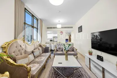 a living room with a couch and a table at Bloomfields Canal View 2Br Apt Canal Business in Dubai
