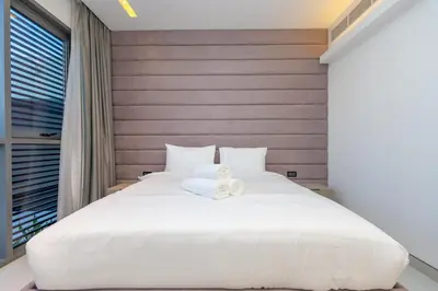 a bedroom with a large white bed and a window at Premium Sidra Villa with Private Pool and Exclusive Stay in Dubai
