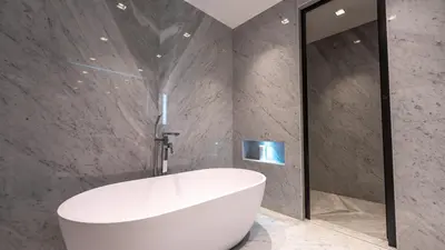 a bathroom with a white tub and a mirror at Premium Sidra Villa with Private Pool and Exclusive Stay in Dubai