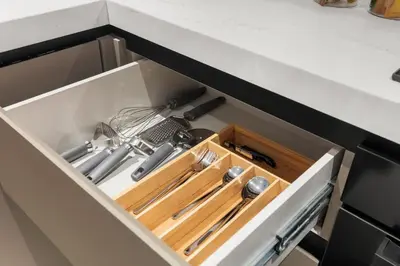 a drawer in a kitchen with utensils at Stylish 2 Bedrooms, Pool, Gym & Family-Friendly in Dubai