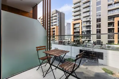 a balcony with a table and two chairs on it at Stylish Studio in Nad Al Sheba in Dubai