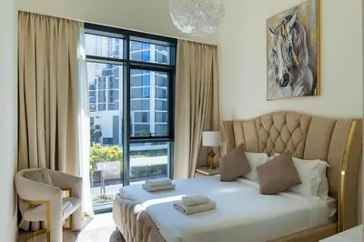 a bedroom with a bed and a large window at Luxury 2BR unit with speculator full road view in Dubai