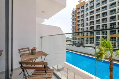 a balcony with a view of a swimming pool at GuestReady - Contemporary elegance in Dubai in Dubai