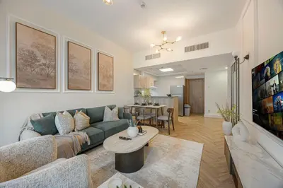 a living room with a couch and a table at Marina Waterfront Bliss - Steps from Promenade in Dubai