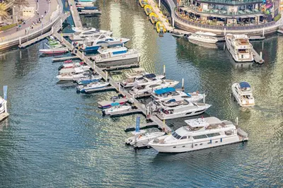 a bunch of boats are docked in a harbor at Daniels 2BR at Liv Marina with Marina View in Dubai