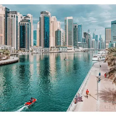 a view of a city with a river and buildings at Marina Oasis JBR Beach in Dubai