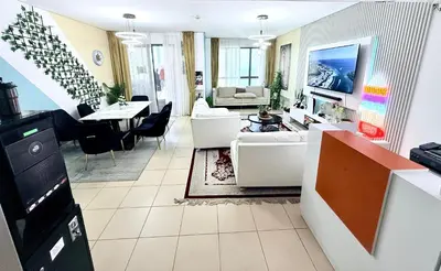 a living room with a couch and a table at WAHA WOW Bed space Available in Luxury Apartment in Sabkhah
