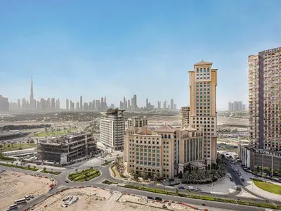 an aerial view of a city with tall buildings at Livin' Holidays - 2BR - Skyline View with Burj Glimpse in Dubai