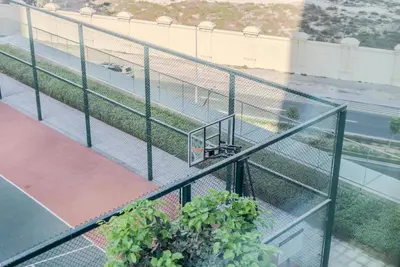 an overhead view of a balcony with some plants at TRPS - Downtown Views II T2, Downtown Dubai - Modern 3BR Home, Maids Room, Full Burj Khalifa View in Dubai