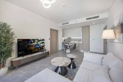 a living room with a couch and a table at LUX 1 BDR apartment Downtown - Burj Khalifa view in Dubai