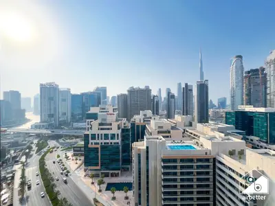 an aerial view of a city with tall buildings at 2BR Panoramic Skyline Haven with Jacuzzi in Dubai