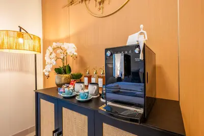 a kitchen with a coffee maker on a counter at Exquisite Studio by UDH Sway Residence at Dubai Hills in Dubai