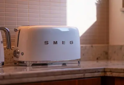 a toaster sitting on top of a kitchen counter at Luxury 2 Bed in Boulevard Point with City Views in Dubai