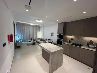 a large kitchen and living room with a counter top at Amazing Dubai Silicon Oasis Rental Apartments in Dubai